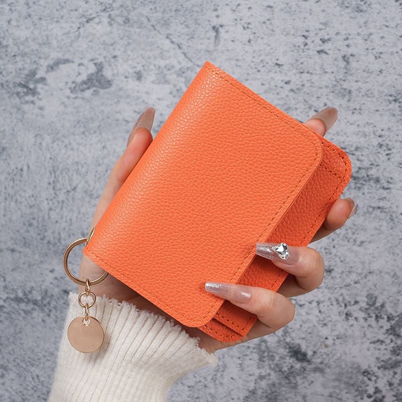 Elegant and Minimalist Women's Slim Short Wallet – with card slots, a bill compartment, and an ID window