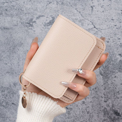 Elegant and Minimalist Women's Slim Short Wallet – with card slots, a bill compartment, and an ID window