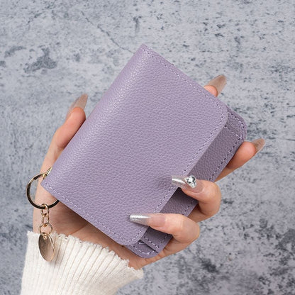 Elegant and Minimalist Women's Slim Short Wallet – with card slots, a bill compartment, and an ID window